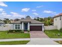 Attractive single-story home with a well-manicured lawn, tidy landscaping, and an attached two-car garage at 1740 Standing Rock Cir, Oakland, FL 34787