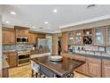 Traditional kitchen with wooden cabinets, stainless steel appliances, and unique backsplash at 1800 Wycliff Dr, Orlando, FL 32803