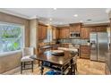 Traditional kitchen featuring wooden cabinetry, stainless steel appliances, and a center island at 1800 Wycliff Dr, Orlando, FL 32803