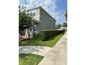 A beautiful home with a covered porch and manicured landscaping at 2403 Biscotto Cir, Davenport, FL 33897