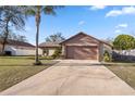 Charming home featuring a spacious driveway and lush front yard at 288 Garland, Deltona, FL 32725