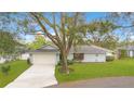 Charming single-story home with well-manicured lawn and mature trees in a peaceful neighborhood at 4029 Cool Water Ct, Winter Park, FL 32792