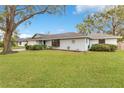 Charming single-story home with well-manicured lawn and mature trees in a peaceful neighborhood at 4029 Cool Water Ct, Winter Park, FL 32792