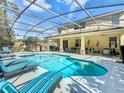 Inviting screened-in pool and patio area, ideal for outdoor dining and lounging at 601 Orange Cosmos Blvd, Davenport, FL 33837