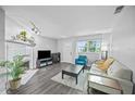 Bright living room with modern furniture, fireplace, and large window at 825 Agnes Dr, Altamonte Springs, FL 32701