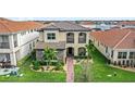 Stunning home boasts a stone facade, a tile roof, and a beautifully landscaped yard, all in a desirable community at 10236 Beechwood Ln, Orlando, FL 32832
