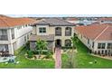 Beautiful two-story home showcases stone detailing, a well-kept lawn, and an inviting pathway at 10236 Beechwood Ln, Orlando, FL 32832