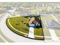 Aerial view of the property showcasing the house, yard, and neighborhood at 1727 Garden View St, Mascotte, FL 34753