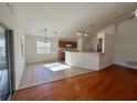 Open concept kitchen with breakfast bar and stainless steel appliances at 2801 Hardenbergh Ln, Eustis, FL 32726