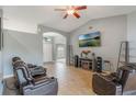 Cozy living room with tile floors, vaulted ceilings, and comfortable leather seating at 2851 Stonewood Cir, Lakeland, FL 33810