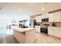 Modern kitchen with stainless steel appliances, white cabinets, and a center island, perfect for entertaining at 2925 Sw 172Nd Lane Rd, Ocala, FL 34473