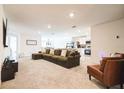 Bright and airy living room featuring an open concept design, seamlessly connected to the modern kitchen at 2925 Sw 172Nd Lane Rd, Ocala, FL 34473