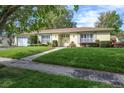 Beautiful single-story home with vibrant lawn and landscaping at 3030 Kingfisher Dr, Orlando, FL 32806