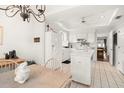 Bright kitchen featuring tile flooring, white cabinets and an island at 5940 Chesapeake Park, Unit # 47, Orlando, FL 32819