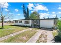 Inviting single-story home with fresh landscaping and a charming front entrance at 7416 Kadel Way, Orlando, FL 32822