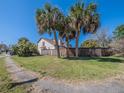 Spacious backyard with privacy fence and lush landscaping providing a serene outdoor retreat at 7861 Copperfield Ct, Orlando, FL 32825