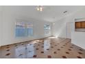 Bright living room with tile flooring, crown molding, and large windows at 8630 Fort Jefferson Blvd, Orlando, FL 32822