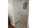 Hallway with neutral wall color, ceramic tile, and white trim at 1168 Woodman Way, Orlando, FL 32818