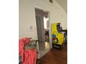 View of the entry way, with a glimpse into the living room with warm wood floors at 1168 Woodman Way, Orlando, FL 32818