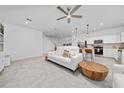 Bright and airy living room with modern decor open to the kitchen at 171 Bogey Dr, Davenport, FL 33896