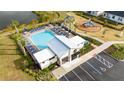 Aerial view of the community pool, playground, and clubhouse amenities at 171 Bogey Dr, Davenport, FL 33896