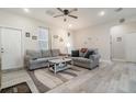 Inviting living room with neutral walls, modern gray sofas, and a ceiling fan at 1959 9Th Ave, Deland, FL 32724