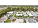 Aerial view of a neighborhood featuring homes, street layouts, and vibrant community living at 200 Patricia Pl, Davenport, FL 33897