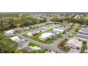 Overhead view of the community exhibiting homes, street networks and the surrounding foliage at 200 Patricia Pl, Davenport, FL 33897