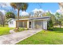 A charming front porch with a swing invites relaxation at 20639 Sw Rainbow Lakes Blvd, Dunnellon, FL 34431