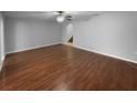 Spacious living room with hardwood floors, ceiling fan, and an open layout at 2722 Dodds Ln, Kissimmee, FL 34743
