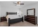 Comfortable bedroom featuring a ceiling fan, neutral colors, and dresser at 359 Quarry Rock Cir, Kissimmee, FL 34758