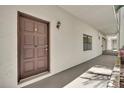Condominium front door with dark brown color and unit number 107 at 535 N Interlachen Ave # 107, Winter Park, FL 32789