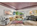 Bright living room showcasing contemporary decor, a rug, and indoor plants at 535 N Interlachen Ave # 107, Winter Park, FL 32789