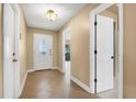 Inviting foyer with tile flooring, a decorative front door, and views into the home at 769 Dunlap Cir, Winter Springs, FL 32708