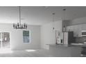 Bright, open kitchen and dining area featuring stainless steel appliances and modern light fixtures at 12793 Sw 43Rd Cir, Ocala, FL 34473