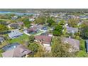 Overhead view of a property in a neighborhood featuring screened-in pools and lush landscaping at 1306 Pleasantridge Pl, Orlando, FL 32835