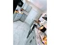Kitchen featuring sleek granite countertops and ample cabinet space for modern convenience at 1511 Leeway Ave, Orlando, FL 32810