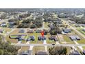 Aerial view of a single-story home in a residential area at 15499 Sw 48Th Ave, Ocala, FL 34473