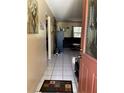 Inviting foyer with tiled floor leading into the living area at 1663 Sunburst Way, Kissimmee, FL 34744