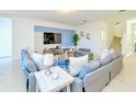 Spacious living room featuring tile floors, comfortable sofas, and stylish decor at 2555 Shanti Dr, Kissimmee, FL 34746