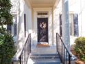 Front porch with decorative floral wreath on the front door and classic architectural details at 2979 Upper Park Rd, Orlando, FL 32814