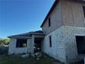 New home under construction featuring block walls, window openings and an unfinished roof at 3627 Lincoln St, Sanford, FL 32771