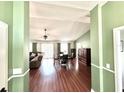 Open-concept living and dining area with hardwood floors and ample natural light at 417 Rio Grande Ct, Kissimmee, FL 34759