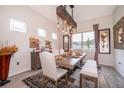 Stylish dining room features a rustic wooden table and decorative lighting at 6117 Sandy Springs Ct, St Cloud, FL 34771