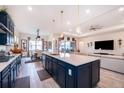 Open-concept kitchen with granite countertops and seamless flow into the dining and living areas at 6117 Sandy Springs Ct, St Cloud, FL 34771