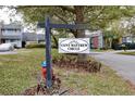 Community sign for Saint Matthew Circle, surrounded by grass, trees, and a fire hydrant at 713 Saint Matthew Cir, Altamonte Springs, FL 32714