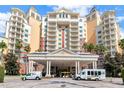 Grand resort entrance featuring stately columns and a circular drive at 7807 Loxahatchee Ct, Reunion, FL 34747