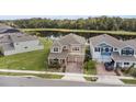 Beautiful home with a two-car garage and serene backyard lake view at 889 Terrapin Dr, Debary, FL 32713