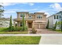 Beautiful two-story home with a two-car garage, well-maintained landscaping, and a welcoming brick driveway at 889 Terrapin Dr, Debary, FL 32713