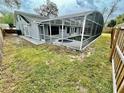 Backyard pool and spa with screen enclosure, ideal for outdoor relaxation and entertainment at 924 Mill Road Ln, Port Orange, FL 32127
